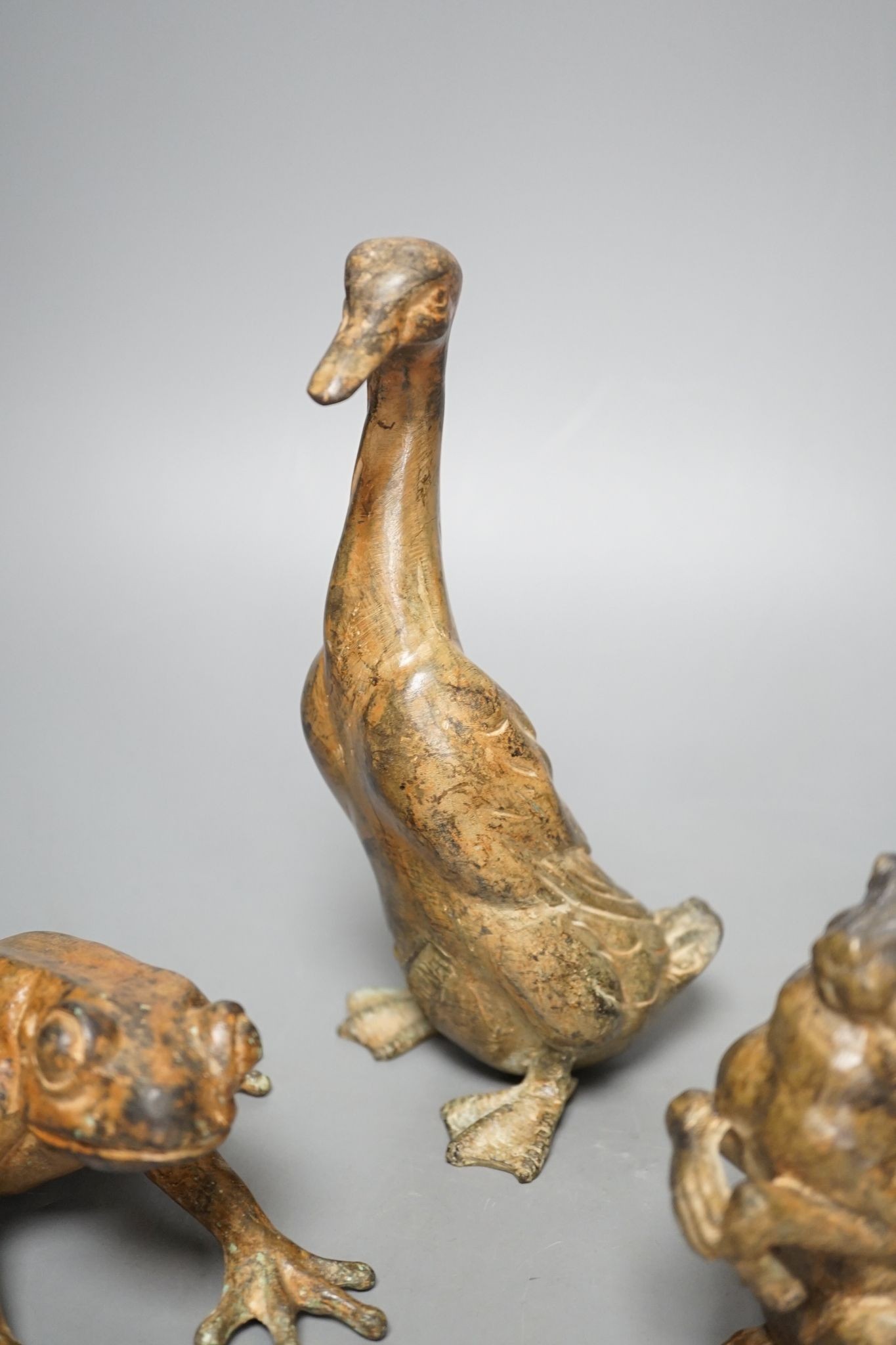 Pierre Chenet Foundry, four small patinated bronzes of a toad, two hares and a duck, largest 19cm high, signed